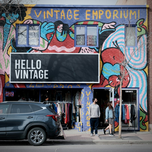 Colorful mural adorns vintage clothing store entrance