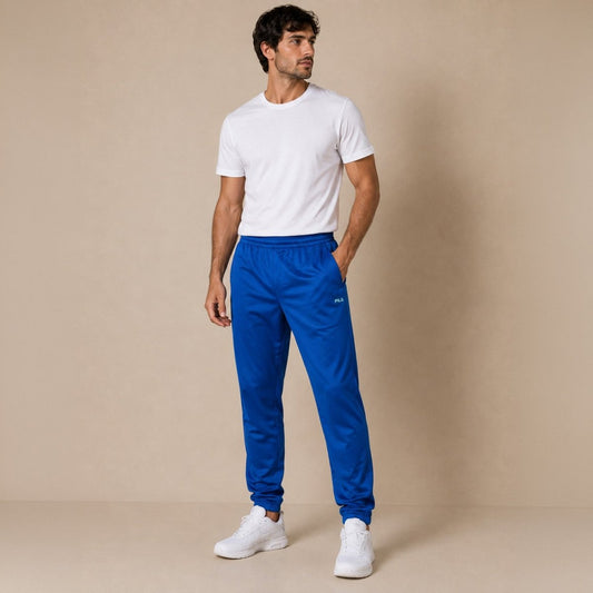 Vintage FILA Men's Track Pants W32 Bright Blue Logo Tape – Trousers product photo 1 | RewearableUK